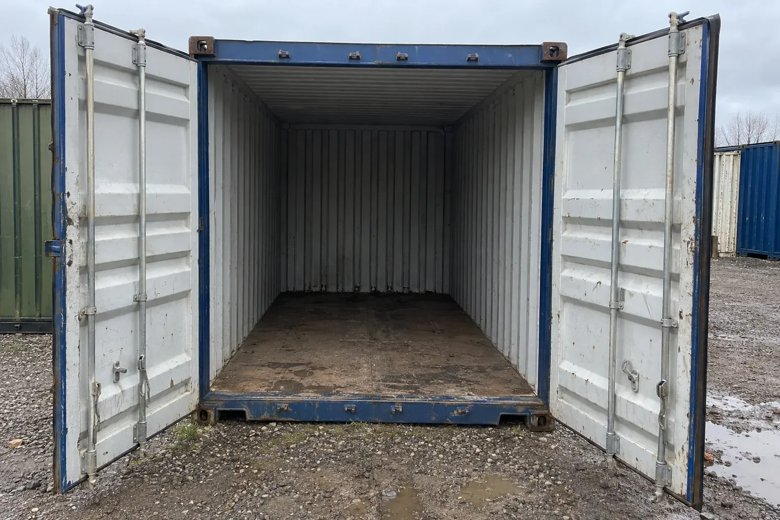 Standard cargo doors open at one end, showing the empty interior and floor